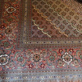 Perzisch tapijt rode tinten